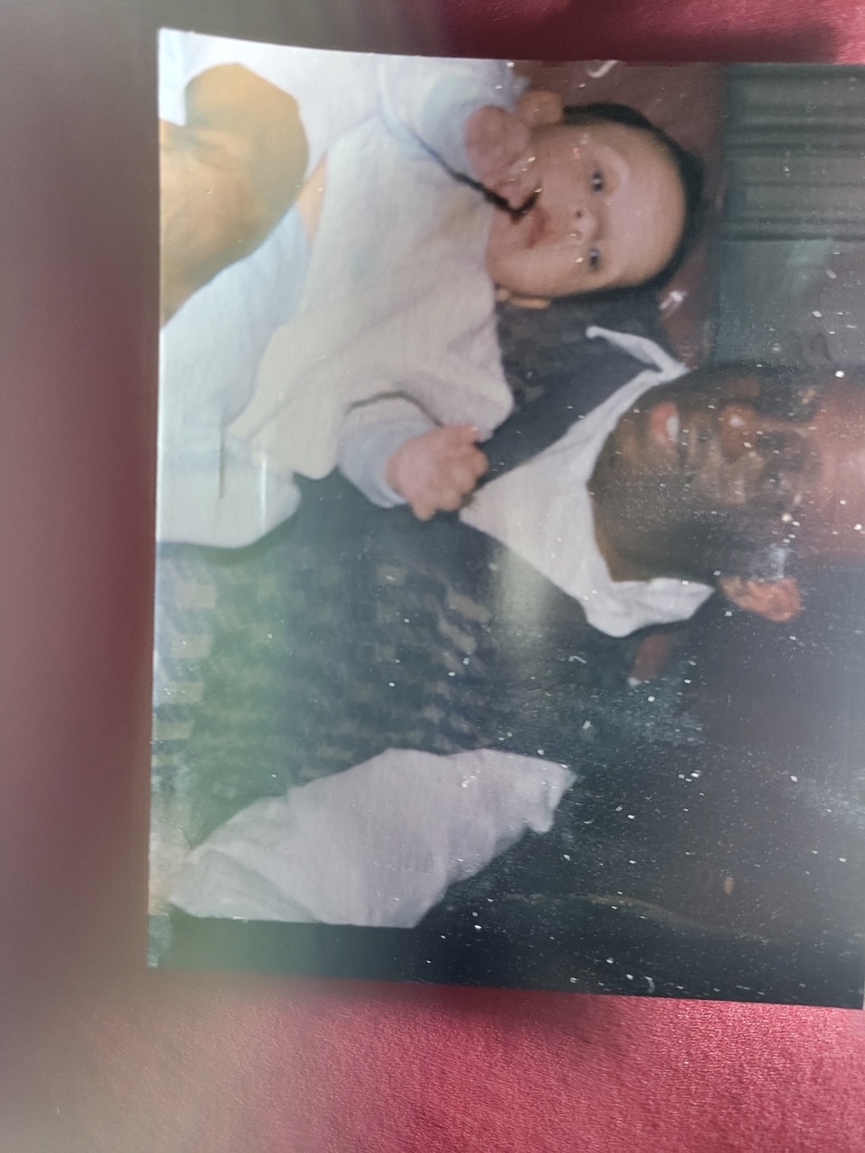 Ede holding a baby — a grandfather's love